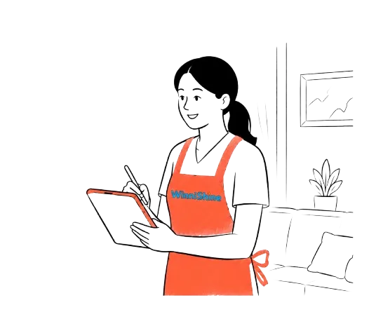 A WinniShine cleaner writing up a free cleaning quote on a tablet